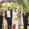 Wedding guests applauding newlyweds