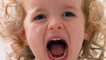 A two year old girl shouting