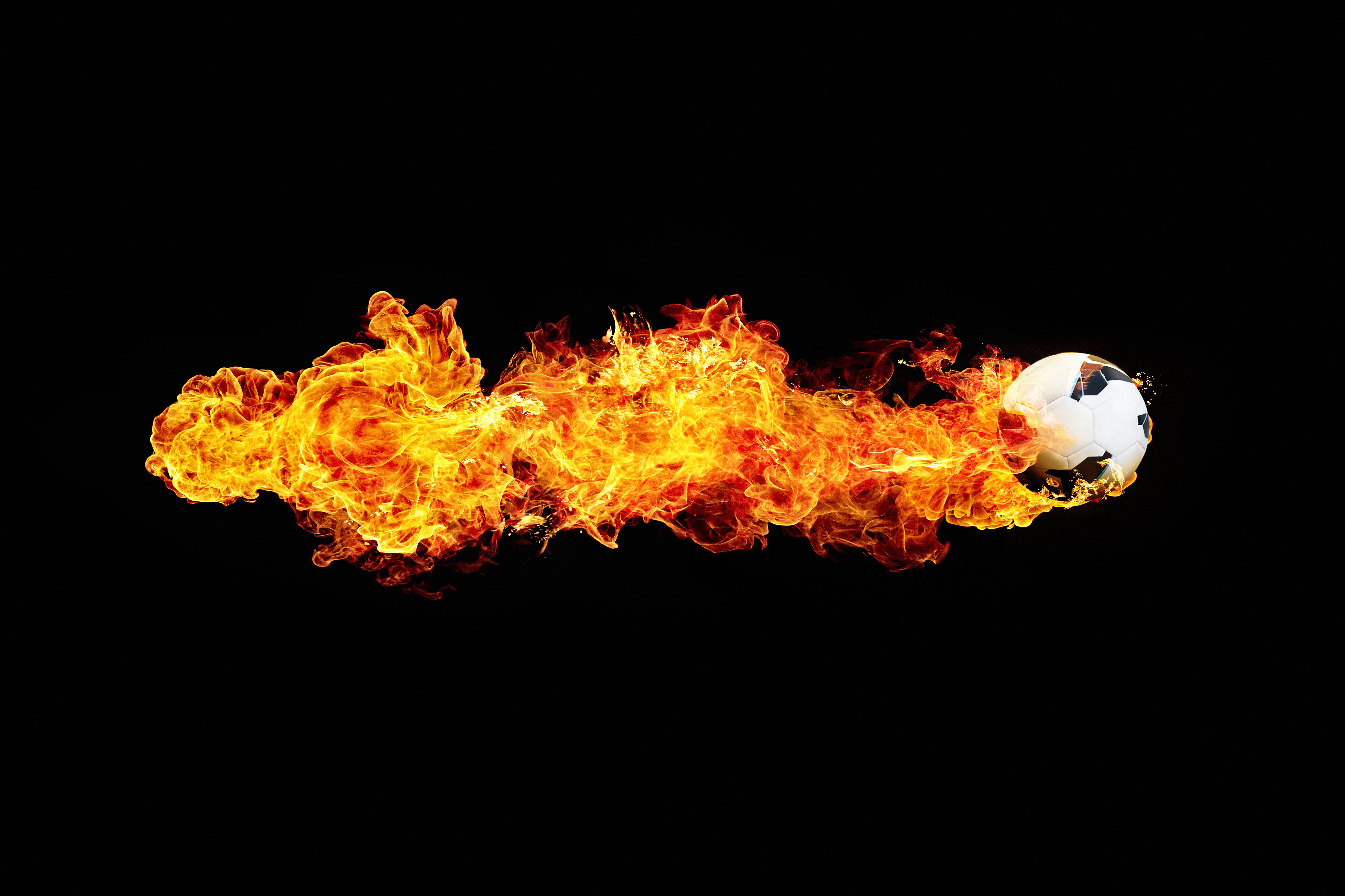 powerful flying football with flame trail