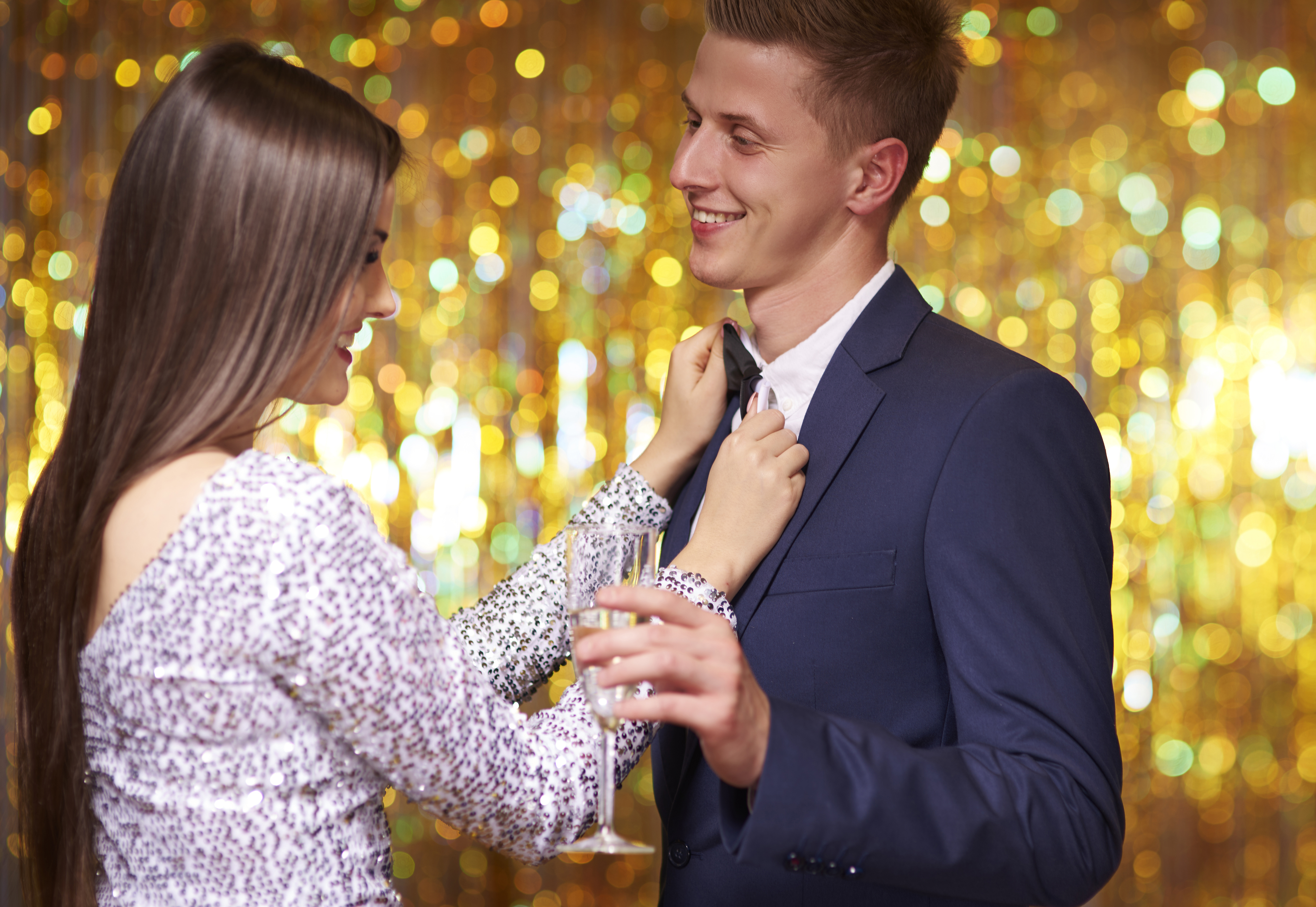 Woman fixing her boyfriends bowtie. Debica, Poland