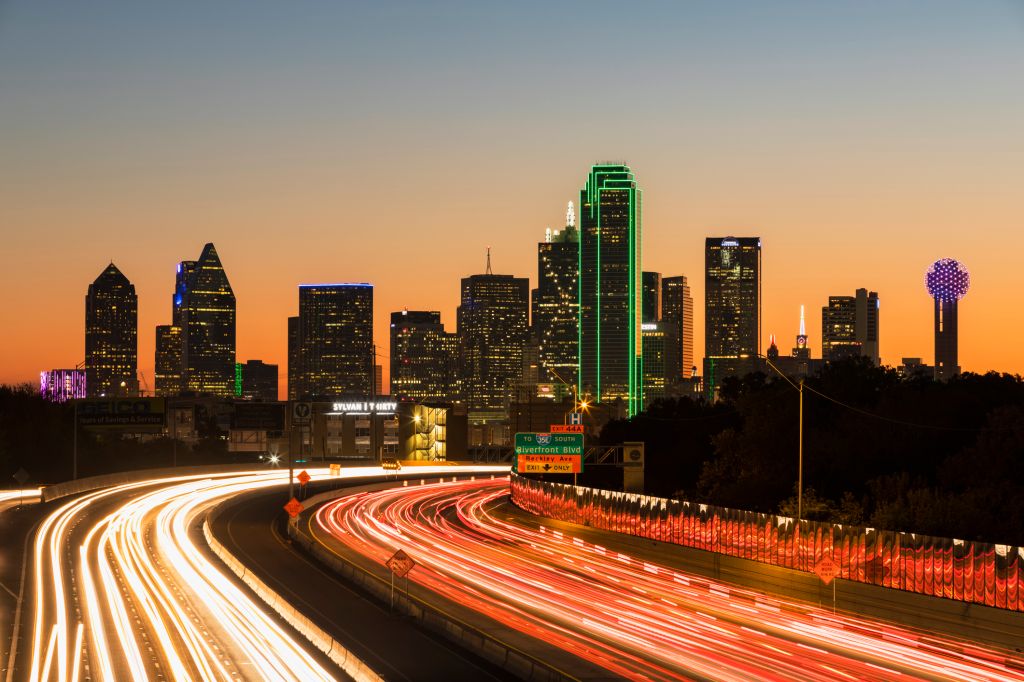 USA, Texas, Dallas, skyline and Tom Landry Freeway, Interstate 30 at night