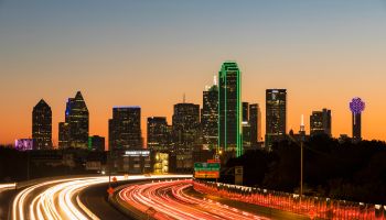 USA, Texas, Dallas, skyline and Tom Landry Freeway, Interstate 30 at night