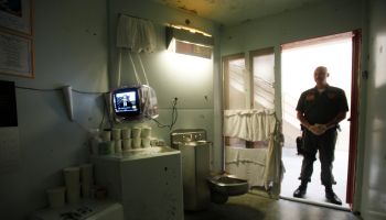 A guard stands in the doorway of one of the Secure Housing Unit (SHU) at Pelican Bay State Prison i