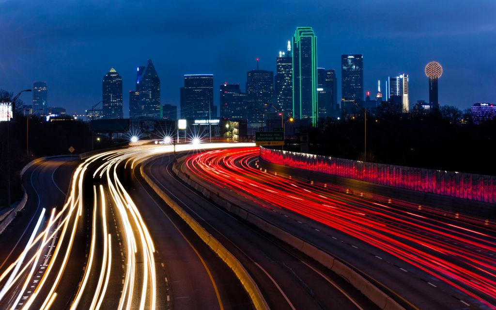 DALLAS SKYLINE and Tom Landry Freeway, with streaked lights