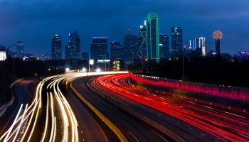 DALLAS SKYLINE and Tom Landry Freeway, with streaked lights