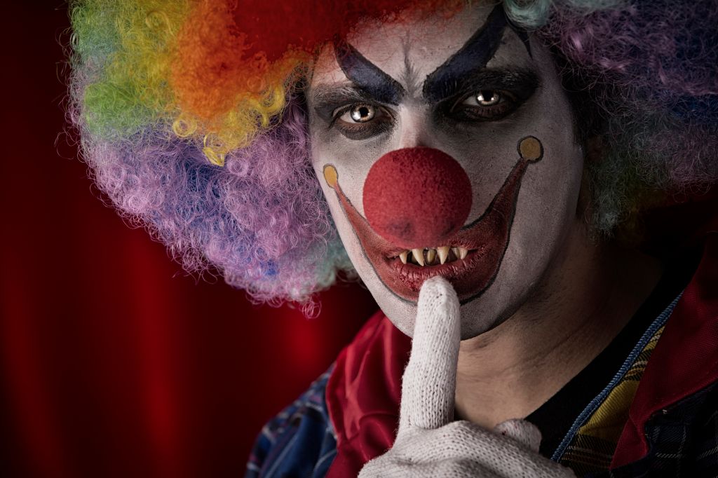 Creepy Clown with fingers on lips