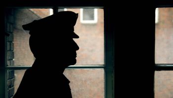 Silhouette of a prison/police warden