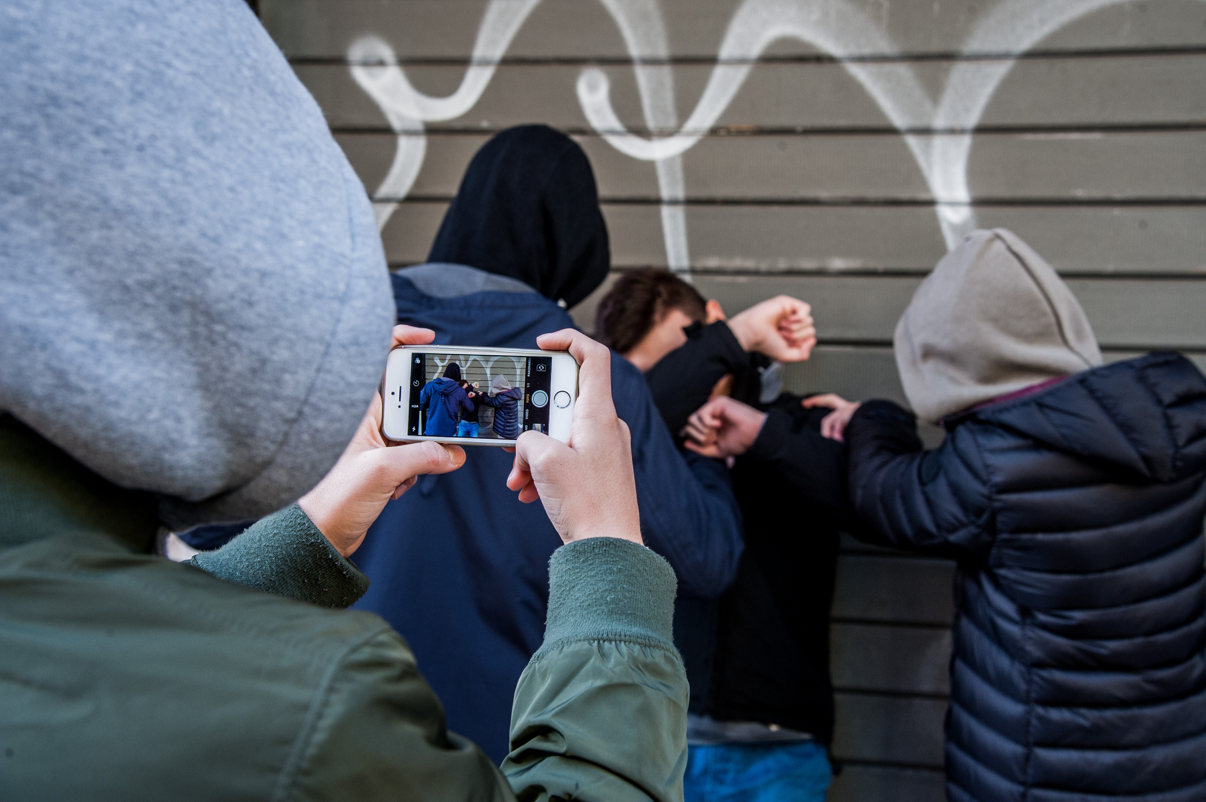 A group of boys bullies a peer in Rome