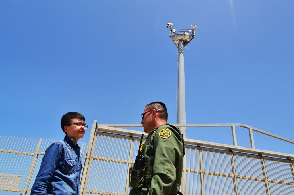 A visitor seen talking to a Border Patrol agent in...