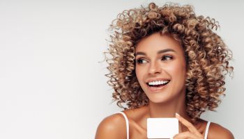 Beautiful woman with business card