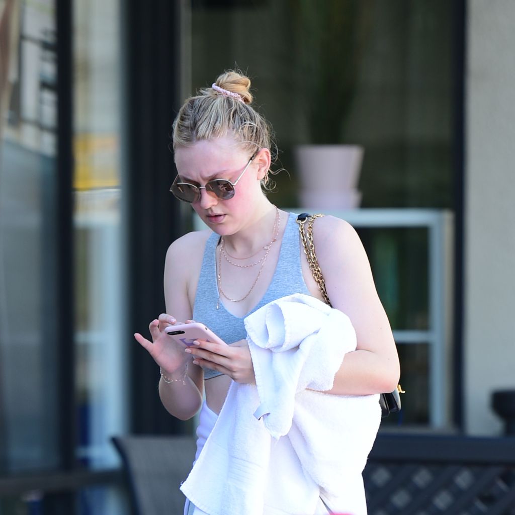 Dakota Fanning looks flushed after a workout at the gym