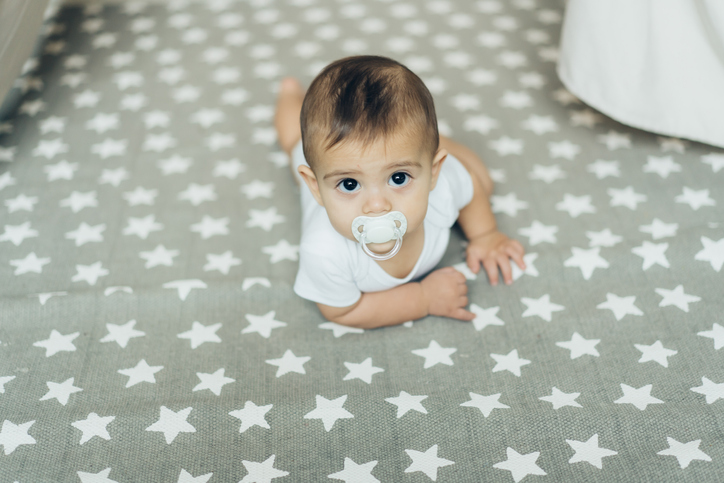 6 month old baby boy posing to camera