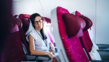 Female passenger sleeping in airplane