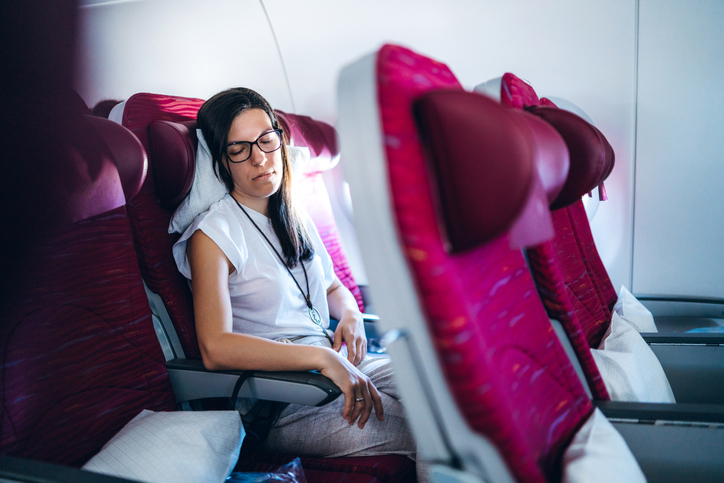 Female passenger sleeping in airplane