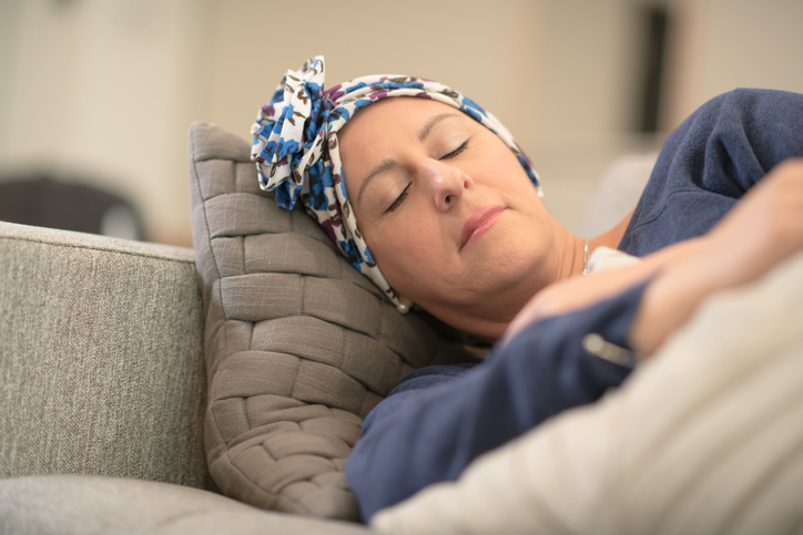 Oncology patient taking nap on the couch