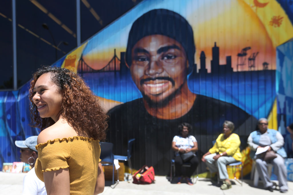 Oscar Grant mural and street rededication outside Fruitvale BART Station