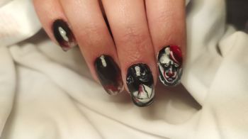 Close-Up Of Woman Fingers With Nail Art Manicure halloween nails