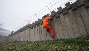 Prisoner escaping from prison.