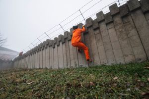 Prisoner escaping from prison.