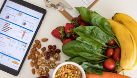 Digital nutritional program with heathy food and digital tablet charts