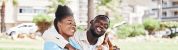 Couple on garden picnic date, black woman and drink bottle of beer together. Young african man, drinking alcohol and happy girl. Outdoor nature, park in city and love relationship time together