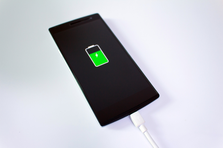 Close-Up Of Mobile Phone Over White Background