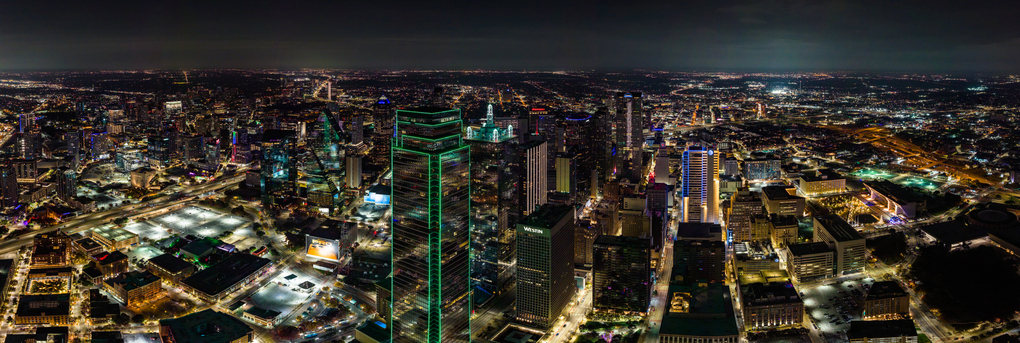 Panorama Aerial Drone over downtown Dallas, Texas at night