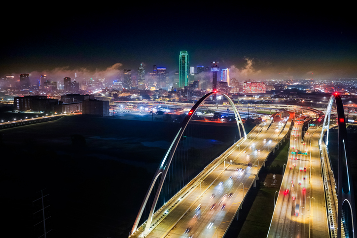 Aerial Drone over downtown Dallas, Texas at night