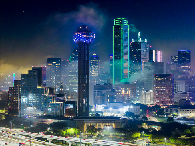 Aerial Drone over downtown Dallas, Texas at night