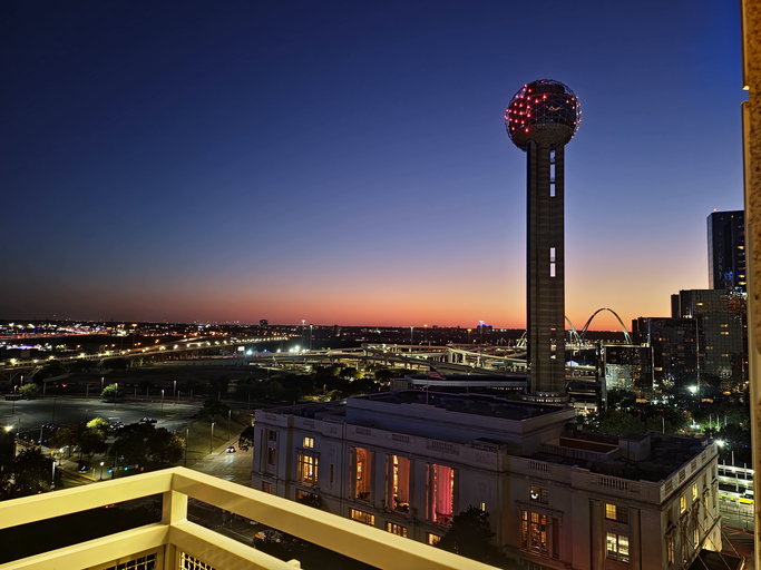 High angle view of the illuminated Dallas skyline at dusk, featuring Reunion Tower and city lights against a vibrant sky,Dallas,United States,USA