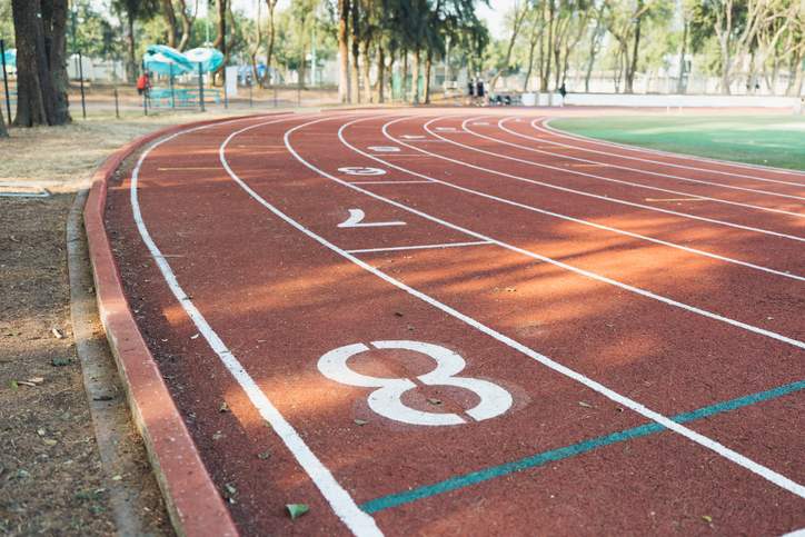 Running track curve with lane markings and numbers