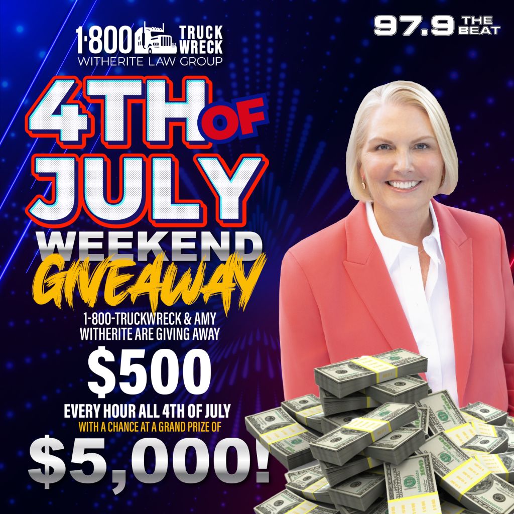A smiling woman in a pink blazer standing next to stacks of cash. Text: "4th of July Weekend Giveaway", "$500 every hour all 4th of July", "$5,000 grand prize", "1-800-TRUCKWRECK & AMY WITHERITE ARE GIVING AWAY".