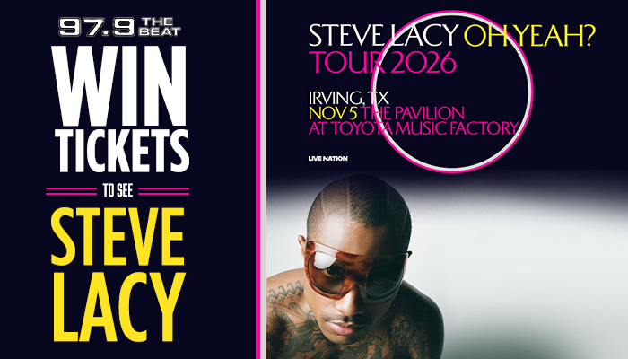 A man with sunglasses and tattoos, standing in front of a concert poster for "Steve Lacy Tour 2026" at the Irving TX Pavilion.